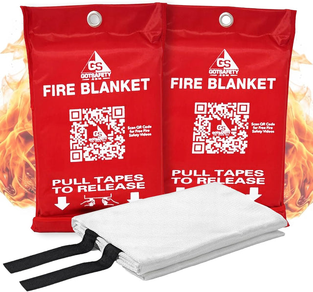 GotSafety Fire Blanket 2-pack — two red pouches with pull-tape release and folded fiberglass blanket shown in front, flames in background